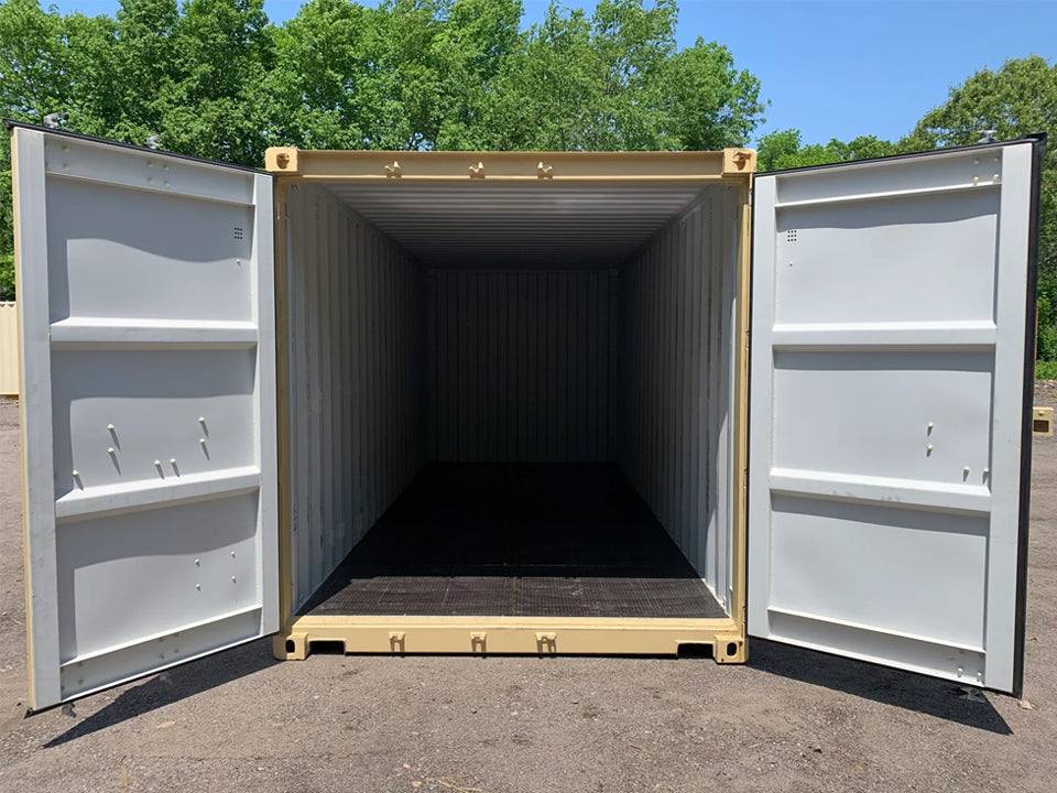 Interior view of a new shipping/storage container with doors open, showcasing clean, coated floors and ample space.