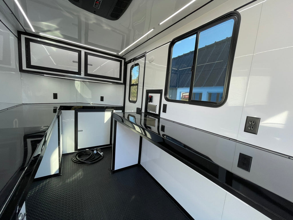 Portable fiber optic trailer with AC, heat, and splicing doors