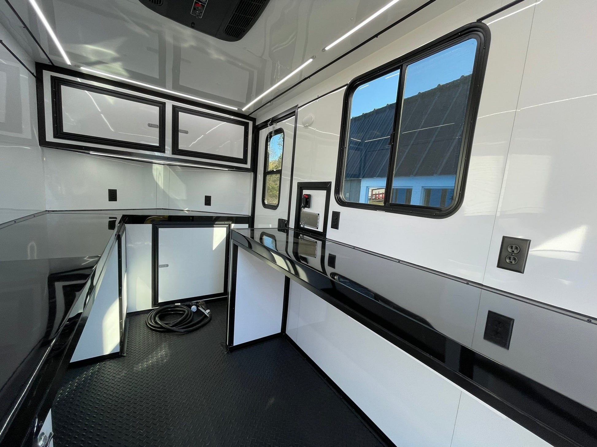 Portable fiber optic trailer with AC, heat, and splicing doors